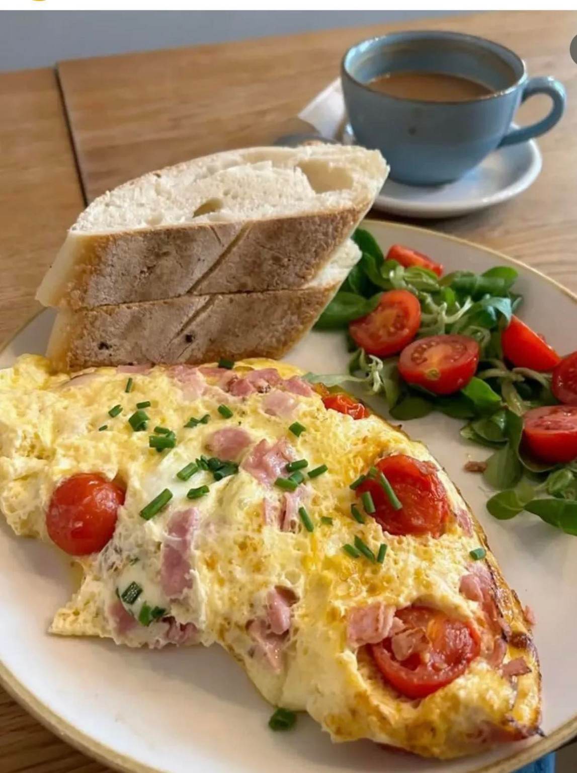Addowaah breakfast with bread, omelette and hot drink